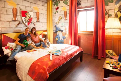 LEGOLAND holiday village castle rooms with family on a bed