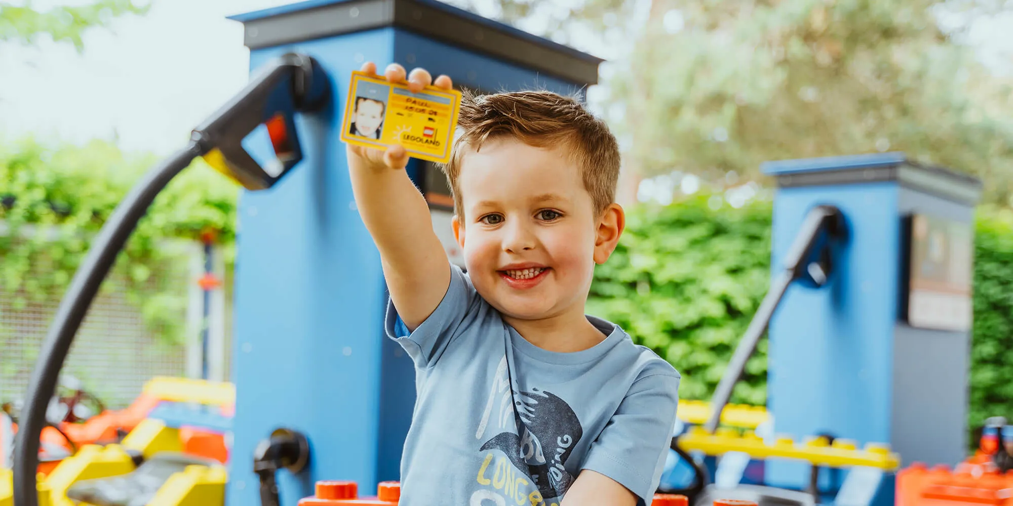 Little boy with driving licence at LEGOLAND Junior Driving School