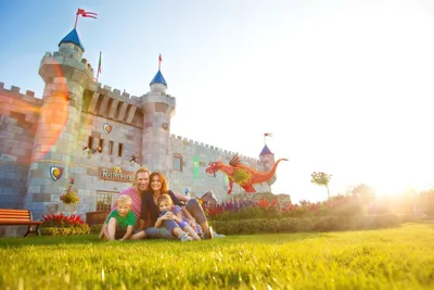 Family in front of LEGOLAND holiday village knights castle