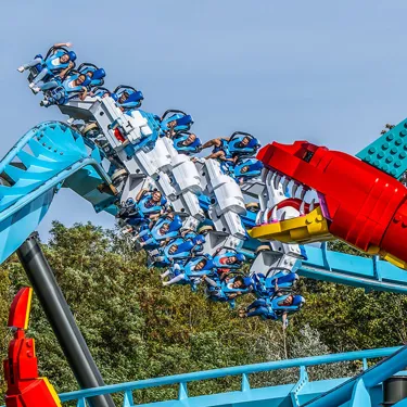 MAXIMUS roller coaster with guests at LEGOLAND Deutschland