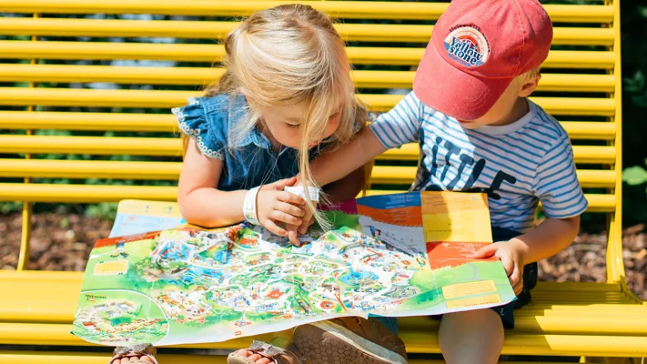 Children read LEGOLAND park map