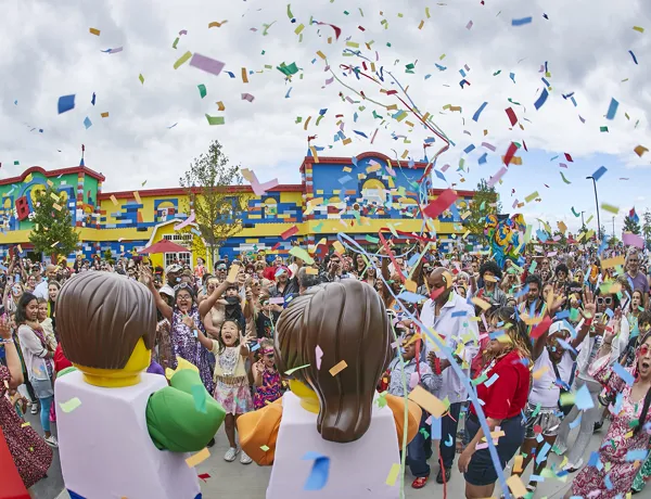 LEGO Festival with two walking characters, many guests and lots of confetti