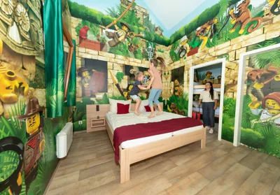 Children on bed in the LEGOLAND Holiday Village Adventurer Room