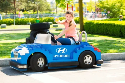 Girl in the car for children at LEGOLAND driving school