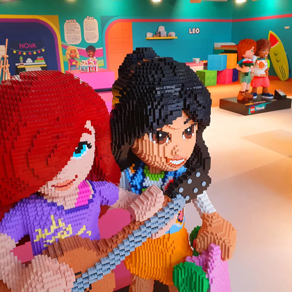 Two large LEGO Friends figures in the LEGO Friends room at LEGOLAND Deutschland