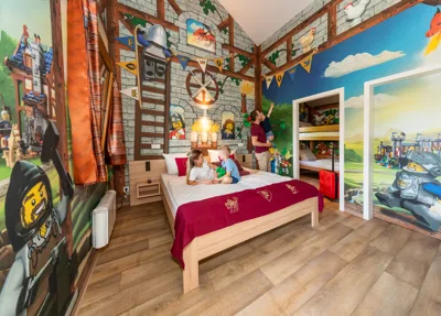 Mother and son on bed in LEGOLAND Holiday Village Knight Room