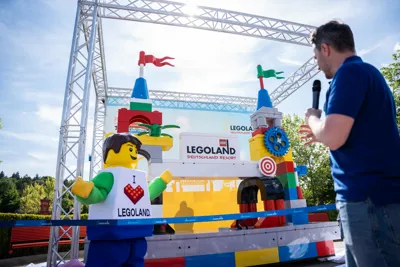 LEGOLAND Boy in front of parade float at LEGOLAND Parade at LEGOLAND Deutschland Resort