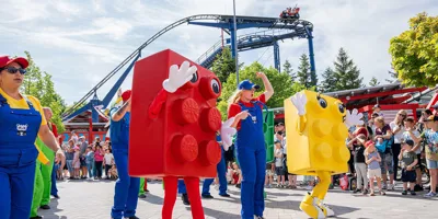 LEGOLAND parade with dancers and red & yellow running LEGO brick