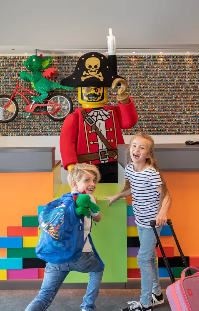 Children and LEGO pirate figure in LEGOLAND vacation village reception