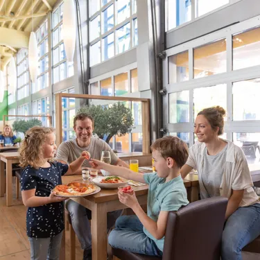 Family eats pizza and pasta at LEGOLAND Restaurant Pizza Mania