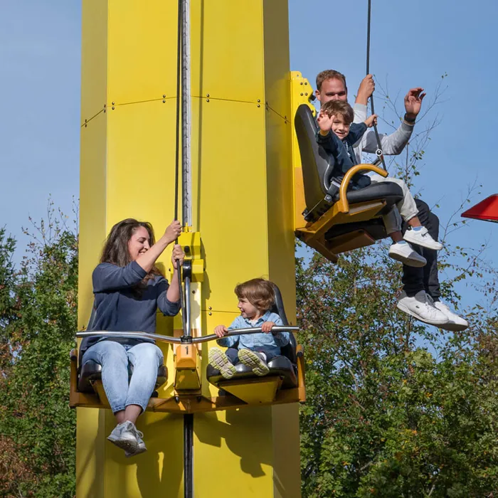 Two adults and two children in the Kids Power Tower at LEGOLAND