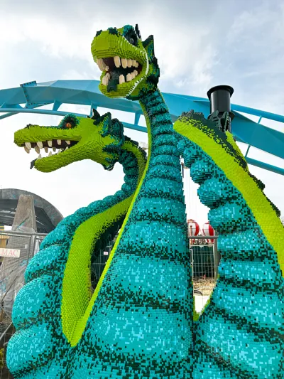  Hydra figure made of LEGO bricks in front of Maximus roller coaster at LEGOLAND Deutschland